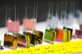 A variety of silicon chip micro-reactors developed by the MIT team. Each of these contains photonic crystals on both flat faces, with external tubes for injecting fuel and air and ejecting waste products. Inside the chip, the fuel and air react to heat up the photonic crystals. In use, these reactors would have a photovoltaic cell mounted against each face, with a tiny gap between, to convert the ...