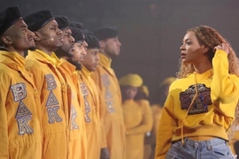 Joe Brown '07 (second from left) performs with Beyoncé and her dance team at Coachella 2018.