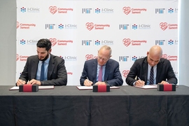 This morning’s ceremonial signing at the J-Clinic launch event. From left to right: Hassan Jameel, president of Community Jameel Saudi Arabia; L. Rafael Reif, president of MIT; Fady Jameel, president of Community Jameel International.