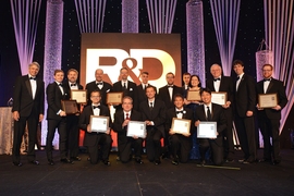 The principal researchers of  Lincoln Laboratory's 12 finalists for 2018 R&D 100 Awards pose with Lincoln Laboratory Director Eric Evans (far left). The principal researchers of the 10 winning technologies are holding their award plaques.