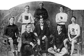 Several members of America's first Olympic team in 1896. Standing: T.E. Burke, Thomas P. Curtis, '94, Ellery H. Clark. Seated: W.W. Hoyt, Sumner Paine, Trainer John Graham, John B. Paine, Arthur Blake.
