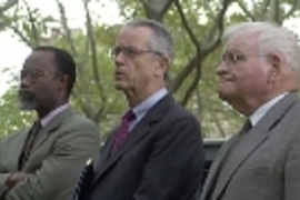 Chancellor Phillip Clay (left), President Charles Vest (center) and President Emeritus Paul Gray listen to speakers and music at the MIT community gathering