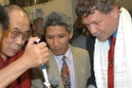 The Dalai Lama. left, pipettes isopropel into mouse DNA during a tour of the Whitehead Institute/MIT Center for Genome Research. To his left is his translator, Thupton Jinpa, and Eric Lander, director of the center.