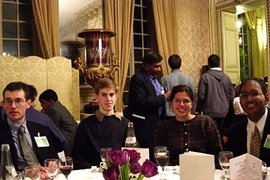 From left, MIT juniors Benjamin Schwartz and Sean Markan, alumna Natalia Toro, and sophomore Chintan Hossain enjoy themselves during a banquet at the Physics for Tomorrow conference held in Paris.