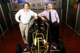 Jeroen Struben, left, and John D. Sterman, of the Sloan School, with an alternative vehicle in the MIT Museum.