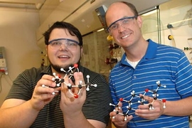 MIT Professor Tim Jamison, right, and co-author Ivan Vilotijevic, a grad student in chemistry, have discovered how the organisms behind red tide may produce the algal bloom's toxic effects. They hold models of molecules that, in water,Â transform into representative portions of the red tide toxins.