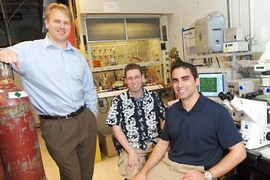 An MIT team has created polymer-DNA nanoparticles to deliver disease-fighting genes . From left are Daniel Anderson, a research associate at the MIT Center for Cancer Research, bioengineering graduate student Jordan Green and Greg Zugates, a Ph.D. candidate in chemical engineering.