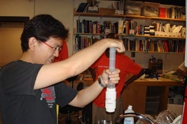 Royce Chew from Singapore works on a low-cost water testing device at last year's International Development Design Summit at MIT.