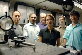 From left, graduate student YongKeun Park, School of Engineering Dean Subra Suresh, Professor Michael Feld, and postdocs Monica Diez-Silva, George Lykotrafitis and Wonshik Choi stand in the MIT Spectroscopy Laboratory. The group has used microscopy techniques to show in unprecedented detail how the malaria parasite attacks red blood cells.