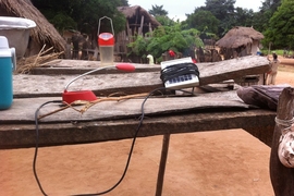 Charging solar lanterns in Ghana as part of an technology evaluation program.