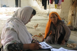 A woman in rural Afghanistan answers questions about the effects of the country&#39;s National Solidarity Program.
