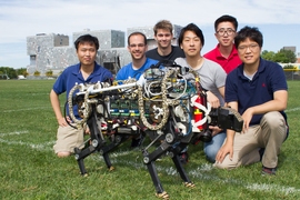 MIT cheetah-bot experiment in Briggs Field. (From left) Sehyuk Yim, Joao Luiz Almeida Souza Ramos, Wyatt L Ubellacker, Sangbae Kim, Xu Sun, and Hae Won Park.