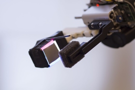 The GelSight sensor, attached to a robot's gripper.
