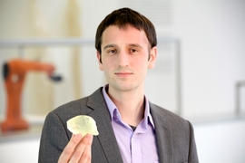 Graduate student Steven Keating holds a 3-D-printed copy of his cancerous astrocytoma brain tumor. It was printed by Keating with data from Brigham and Women’s Hospital.