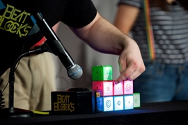 Beat Blocks are color coded, and each block produces a drumbeat, bass line, or melody when snapped onto a base unit.