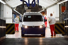 Workers inspect a car on the production line in a Volkswagen factory in Poznan, Poland.