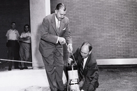 A 1957 photograph shows President James R. Killian Jr. (left) and professor of electrical engineering Harold “Doc” Edgerton burying the time capsule. 