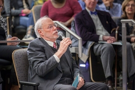 MIT Institute Professor Phillip Sharp asks a question after the lecture.