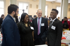 (Left to right) Alberto Hernandez, La-Tarri Canty, President Rafael Reif, and Rasheed Auguste have a conversation before the luncheon.