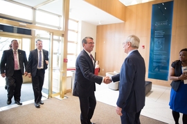 President L. Rafael Reif (right) greets Secretary of Defense Ashton Carter Friday morning at the Sloan School of Management at MIT.
