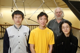 (Left to right) freshman Yunkun Zhou, junior Bobby Shen, mathematics professor Peter Shor, and freshman Danielle Wang.