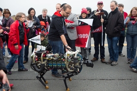 MIT’s robotic cheetah marches along the bridge. 