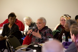 Ayida Mthembu, associate dean of Student Support Services, asks a question during the Dec. 14 luncheon. 