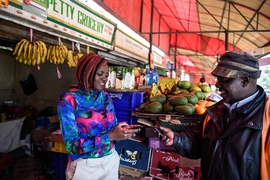 A new study estimates that, since 2008, access to mobile-money services — which allow users to store and exchange monetary values via mobile phone — increased daily per capita consumption levels of 194,000, or roughly 2 percent, of Kenyan households, lifting them out of extreme poverty (living on less than $1.25 per day). 
