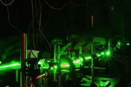 A new system to monitor radiation damage in a material creates acoustic oscillations by using two pulsed laser beams aimed at a sample, in such a way that the light waves of the two beams cause an interference pattern. This interference pattern causes heating at the sample surface, generating a standing acoustic wave. The motion of the surface caused by this wave can be monitored by another set of...