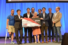 The winning team Lightmatter pose with organizers and friends.