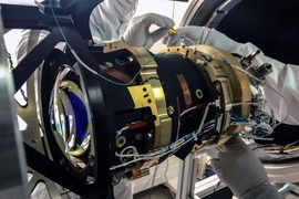 Engineers test one of the TESS cameras at the Kavli Institute lab.
