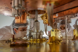 Researchers working on the cryostat.