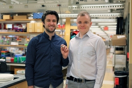 Graduate student Mark Mimee and former MIT postdoc Phillip Nadeau with the ingestible sensor.