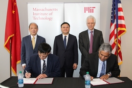 On June 15, 2018, Zhenghe Xu, dean of engineering at SUSTech (seated left) and Anantha Chandrakasan, dean of engineering at MIT (seated right), signed an agreement to establish the Centers for Mechanical Engineering Research and Education at MIT and SUSTech. Standing behind them are Shiyi Chen, president of SUSTech (left), Weizhong Wang, Party Secretary CPC Shenzhen Municipal Committee (center), a...