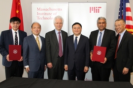 Representatives from MIT, SUSTech, and the Shenzhen government posed after the agreement was signed. From left to right: Zhenghe Xu, SUSTech dean of engineering, Shiyi Chen, president of SUSTech, Richard Lester, associate provost at MIT, Weizhong Wang, Party Secretary CPC Shenzhen Municipal Committee, Anantha Chandrakasan, dean of engineering at MIT and Gang Chen, the Carl Richard Soderberg Profes...