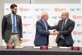 This morning’s ceremonial signing at the J-Clinic launch event. From left to right: Hassan Jameel, president of Community Jameel Saudi Arabia; L. Rafael Reif, president of MIT; Fady Jameel, president of Community Jameel International.