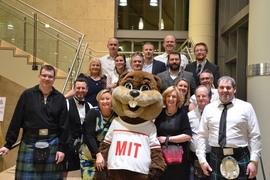 Attendees pose with Tim the Beaver during one of the networking events of the program.