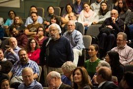 An audience member asks a question following the lecture.