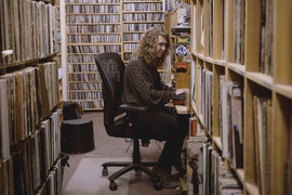 Trevor Henderson in the record library at WMBR, MIT’s student radio station.