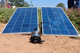 The Khethworks system includes a submersible centrifugal solar pump, a controller, and two solar panels. To get the pump running, farmers connect the panels, pump, and controller, then connect the pump to the piping in the field, drop the pump into the water, and flip the on switch.