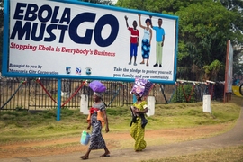 A billboard in Liberia urges people to help stop the spread of Ebola, which was widespread in 2014-2015. A new study shows how a public awareness campaign helped people understand and cooperate with government efforts to control the disease. 