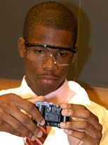 Student Jeremy Gilmore of Baton Rouge, La., quickly discovers how a disposable camera works during 'Engineering at MIT is Fun Day.'