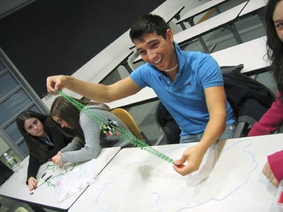 Eleventh-grader Nick Tetreault of Hudson High School examines a model of a mitotic spindle at MIT on March 23. Tetreault was one of dozens of high school biology students who visited the Institute during spring break to see what graduate work in the field is like.