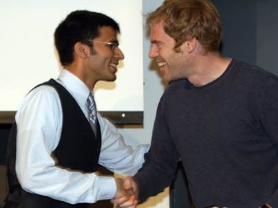 Graduate Student Council President Barun Singh, left, congratulates  B. Scott Francisco G on receiving the Edward L. Horton Fellowship Award. Nicholas  Senske G, who won the same award, did not attend the May 10 event.