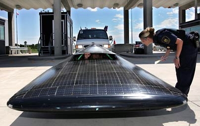 MIT's solar car Tesseract, which recently place third in the North American Solar Challenge, crosses the border at Winnipeg, Manitoba.