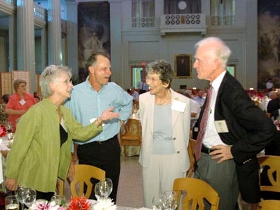 Barbara Peacock-Coady, far left, shares a story with her husband, Joe Coady, left, and Barbara Penfield, right, wife of Paul Penfield Jr, far right.