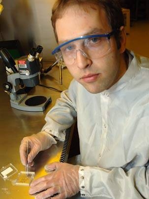 MIT Assistant Professor Karl Berggren of electrical engineering and computer science works on nanowires in the lab.