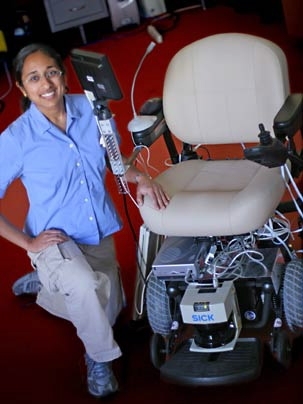 Marshall winner Finale Doshi sits beside a wheelchair equipped with a voice-activated command system she designed.