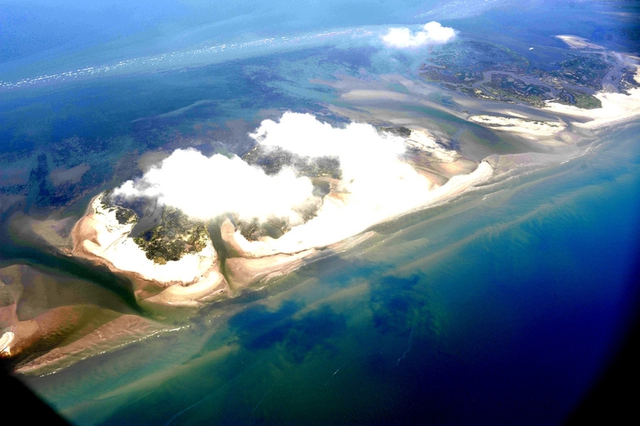 Orange bands of oil and tar can be seen washing up on the Chandeleur Islands.