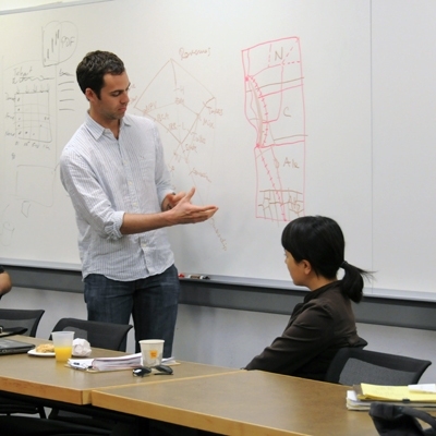 Travis Dunn PhD '10 shows a map of Portugal's main highway routes.